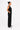 Luxury black wide-leg trousers for women with functional pockets and a flowing silhouette styled for effortless everyday elegance