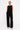 Women's black wide-leg pants with pockets featuring a relaxed fit and elevated minimalist design by YAHKARA