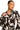 Women's black and ivory matching blouse and wrap skirt set featuring statement sleeves and resort-inspired styling.