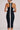 Detail view of black ribbed knit midi dress with premium stretch fabric and racerback design