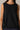 Women's black sleeveless top featuring a relaxed silhouette and elevated minimalist design by YAHKARA