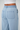 Close up of 100% tencel light wash drawstring pant.