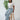 Woman sitting on a stool showing how comfortable the breathable and sustainable Tincel rawstring pant is.