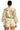 Woman wearing the YAHKARA Amalfi Bloom Set, featuring a lightweight botanical floral button-front blouse with long sleeves and coordinating high-waisted drawstring shorts for a chic resort-inspired look.