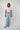 Woman wearing YAHKARA Hudson Wide Leg Pants in a light wash denim-inspired fabric featuring a relaxed wide-leg silhouette, elastic drawstring waistband, and oversized utility pockets.