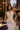 Women wearing a halter pleated maxi dress at a restaurant in the city.