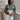 Women's olive green crochet sweater paired with ivory trousers for an elevated spring and summer outfit by YAHKARA.